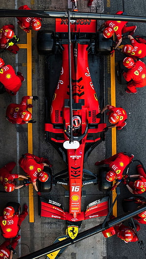 Scuderia Ferrari Formula 1 Pit Stop Aerial View with Crew in Red Overalls HD phone wallpaper