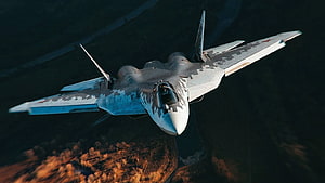 Sukhoi Su-57 Stealth Fighter Jet in Low Altitude Flight Over Rugged Terrain HD wallpaper
