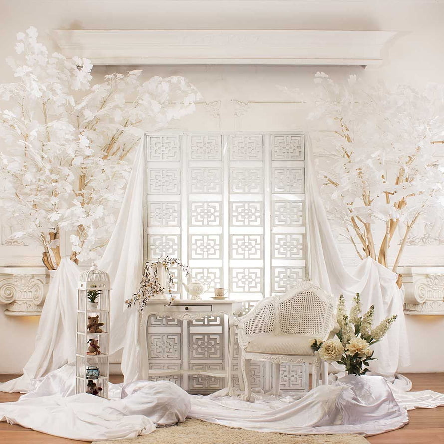 Elegant All-White Indoor Wedding Photo Backdrop with Floral Trees and Draped Fabric HD phone wallpaper