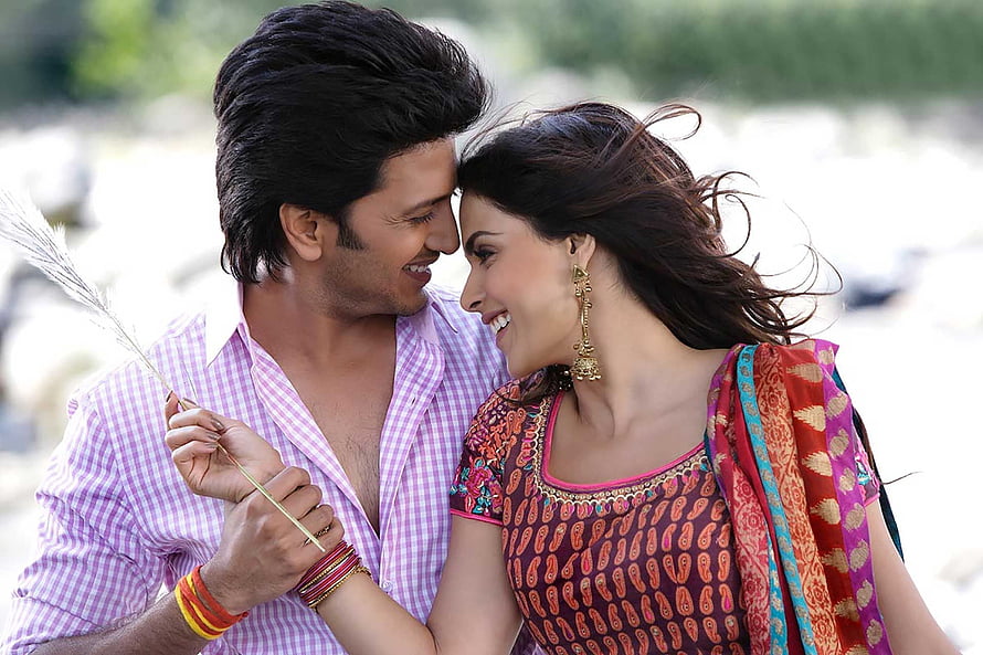 Romantic Indian couple in traditional attire sharing a tender moment outdoors HD wallpaper