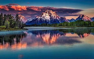 Majestic Snow-Capped Mountain Range Reflected in a Calm Lake at Sunset HD wallpaper