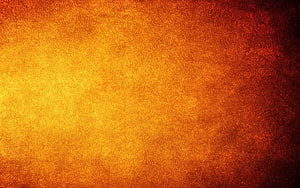 Warm Orange and Red Textured Gradient Background with Grainy Surface HD wallpaper