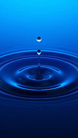 Vibrant Blue Water Droplet Ripples and Splash in Minimalist Macro Photography HD phone wallpaper