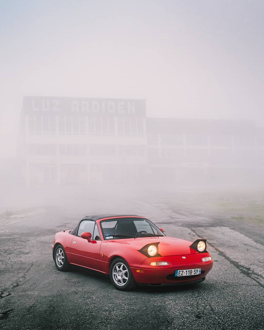 Red Mazda MX-5 Miata First Generation Convertible Parked in Foggy Atmosphere HD phone wallpaper