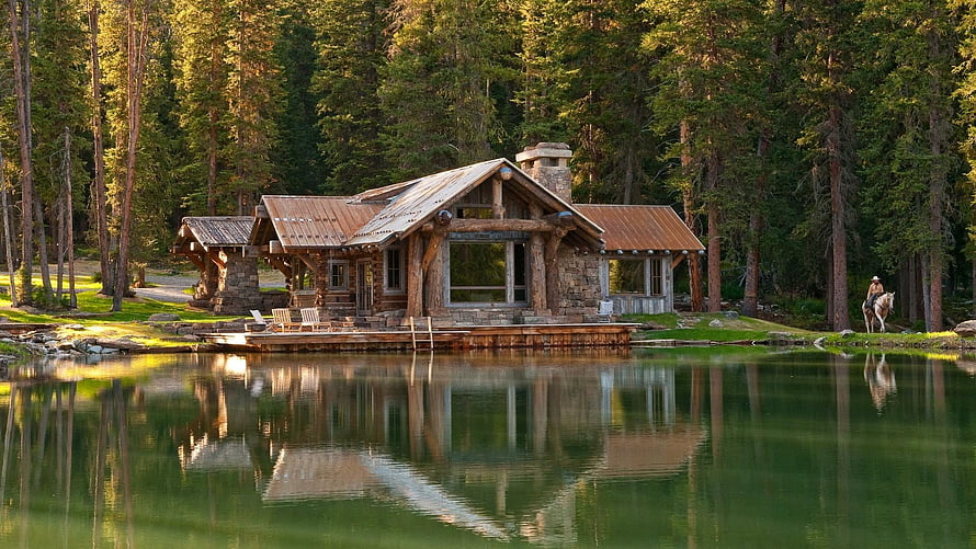 Rustic Log Cabin on a Serene Forest Lake with Perfect Reflections HD wallpaper