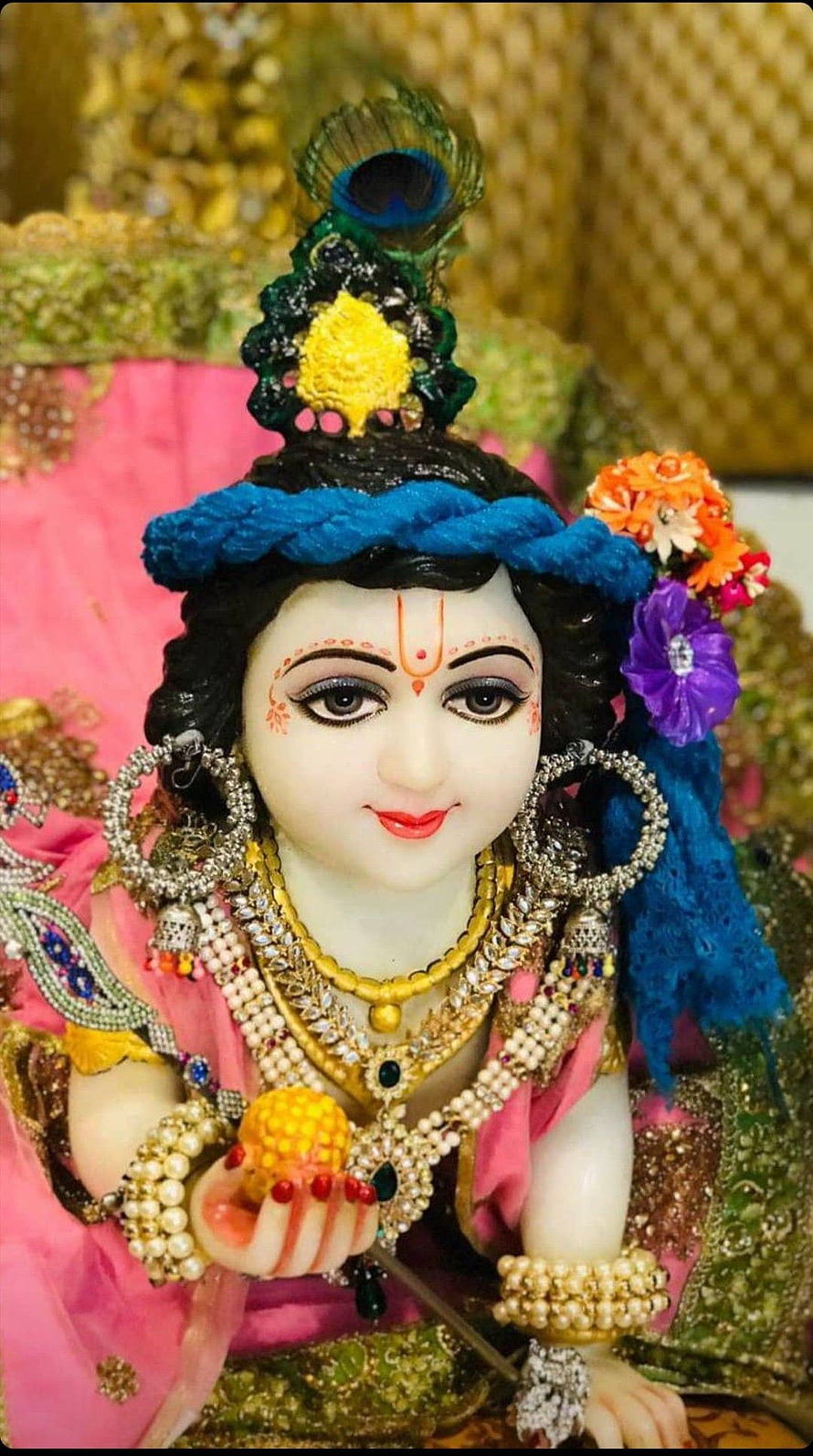 Adorned Krishna Murti with Peacock Crown and Traditional Jewelry HD phone wallpaper