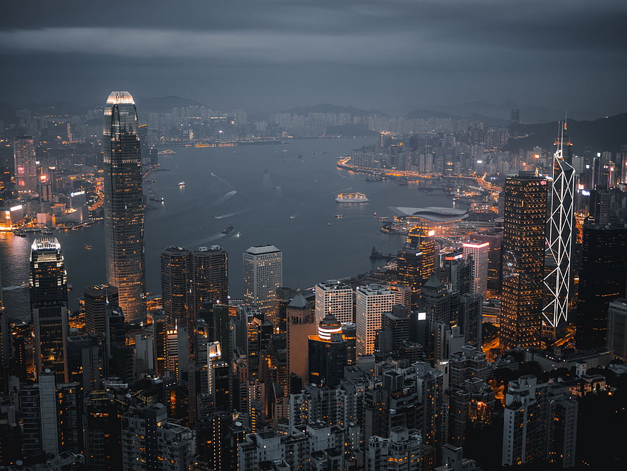 Hong Kong Victoria Harbour Skyline at Dusk with Illuminated Skyscrapers and City Lights HD wallpaper