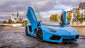 Blue Lamborghini Aventador with Scissor Doors Parked on Cobblestones in Paris HD wallpaper