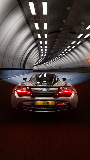 McLaren 720S Supercar Rear View Cruising Through a Modern Illuminated Tunnel HD phone wallpaper