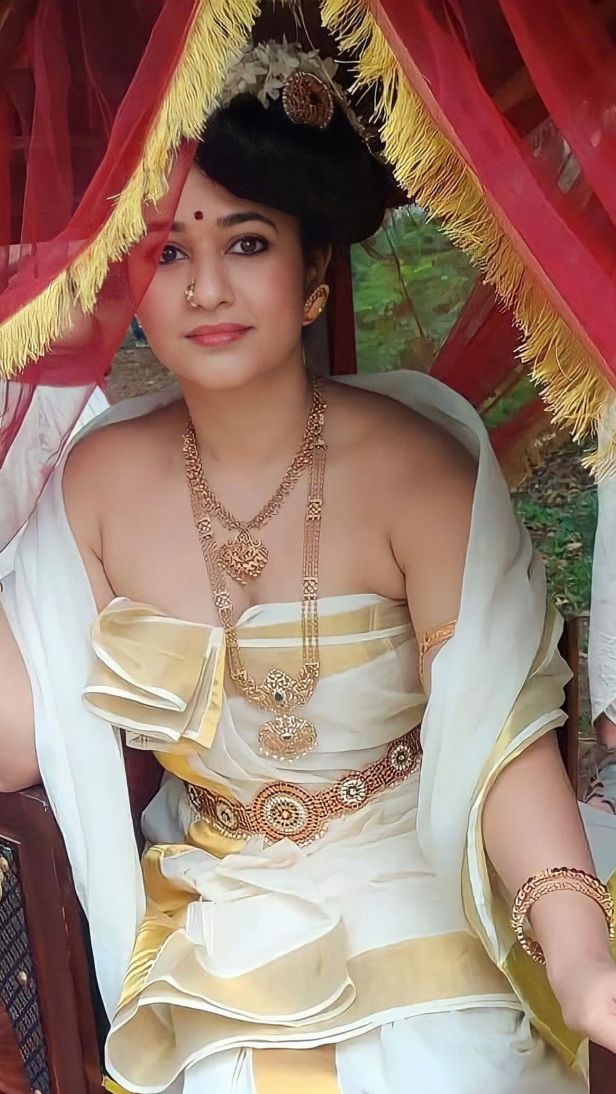 Poonam Bajwa in Traditional Kerala Attire with Gold Jewelry and Red Canopy HD phone wallpaper