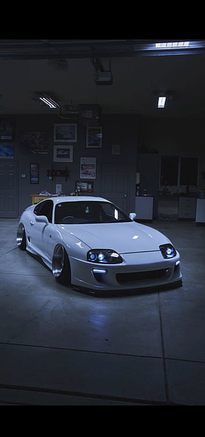 White Toyota Supra MK4 Widebody Stance in a Dimly Lit Garage HD phone wallpaper