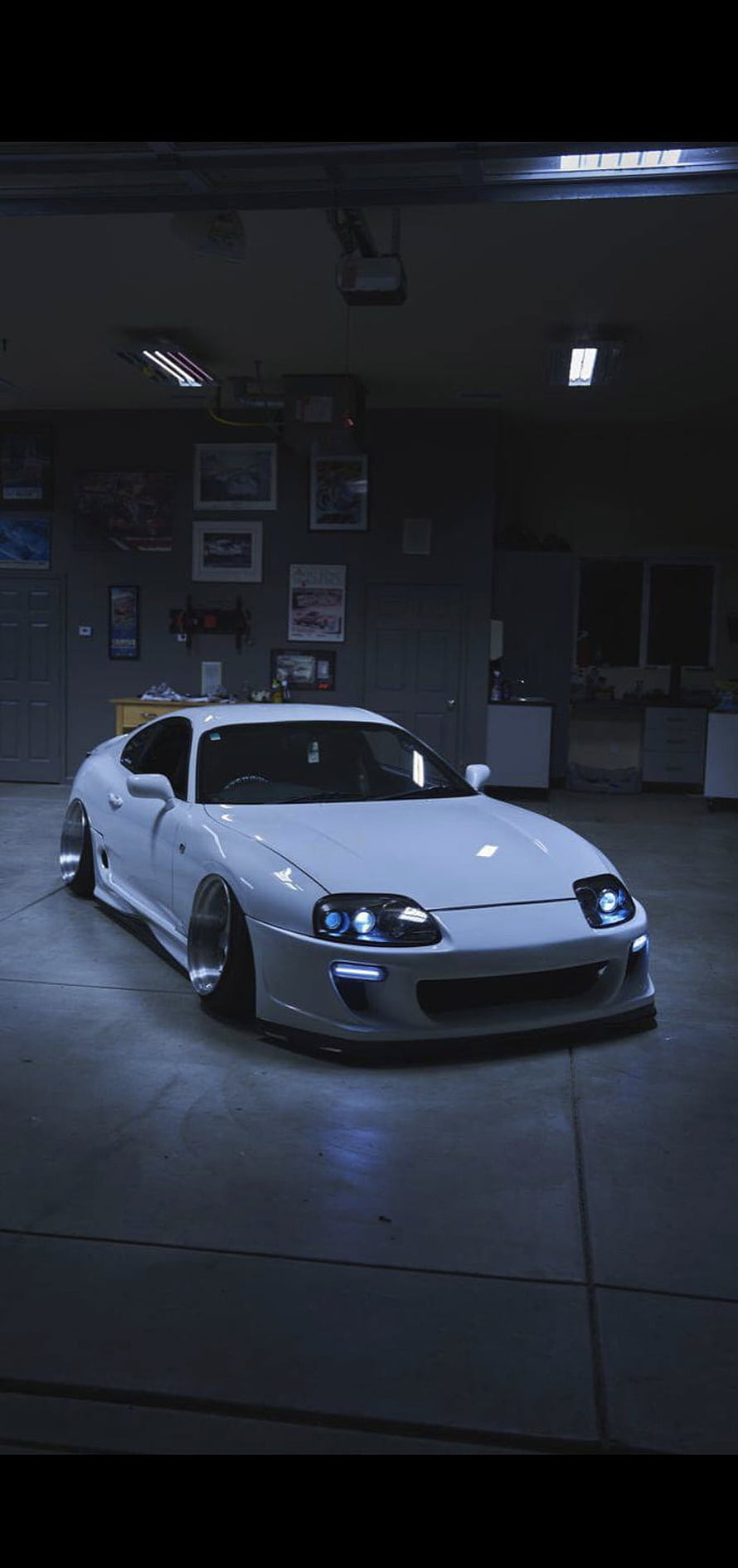 White Toyota Supra MK4 Widebody Stance in a Dimly Lit Garage HD phone wallpaper