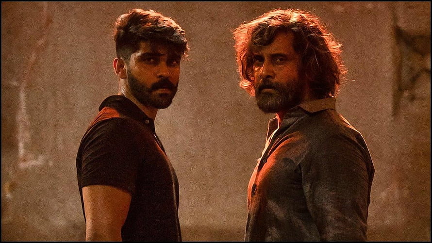 Mahaan Film Still Featuring Chiyaan Vikram and Dhruv Vikram in Dramatic Confrontation HD wallpaper