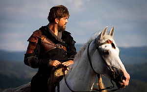 Ertugrul Gazi on horseback in medieval armor overlooking a mountainous landscape HD wallpaper