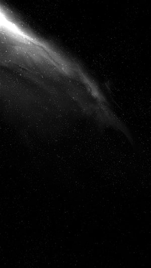 Minimalist Black and White Galaxy with Diagonal Starfield and Nebula Glow HD phone wallpaper