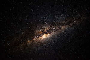 Milky Way Galaxy Core Spanning a Deep Starry Night Sky with Dense Nebulae and Dust Lanes HD wallpaper
