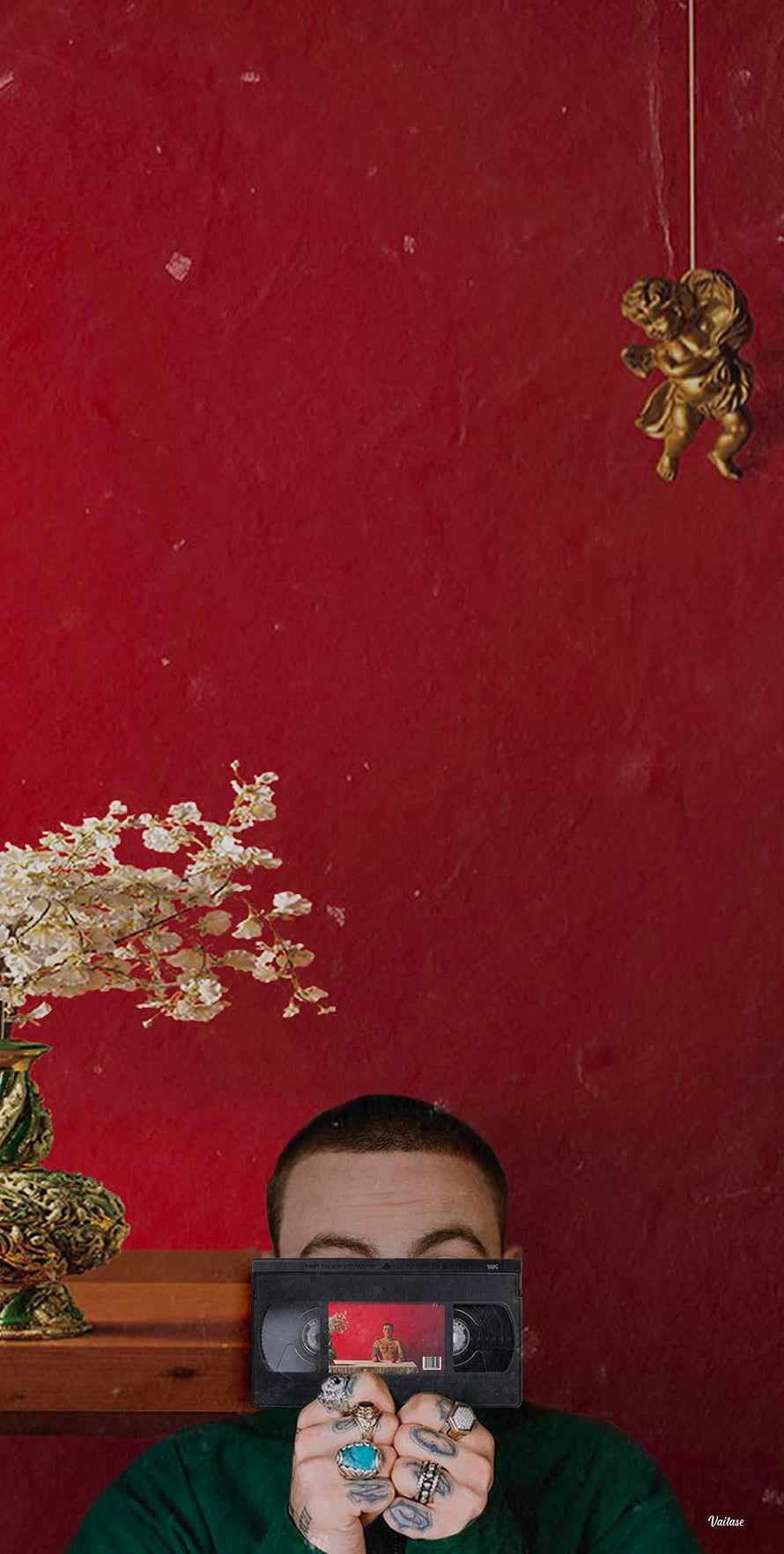 Mac Miller Holding Cassette Tape Against Red Wall With Vintage Decor HD phone wallpaper