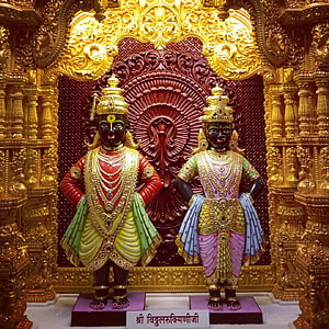 Vitthal and Rukmini Temple Deities in Ornate Gold Carved Shrine HD wallpaper