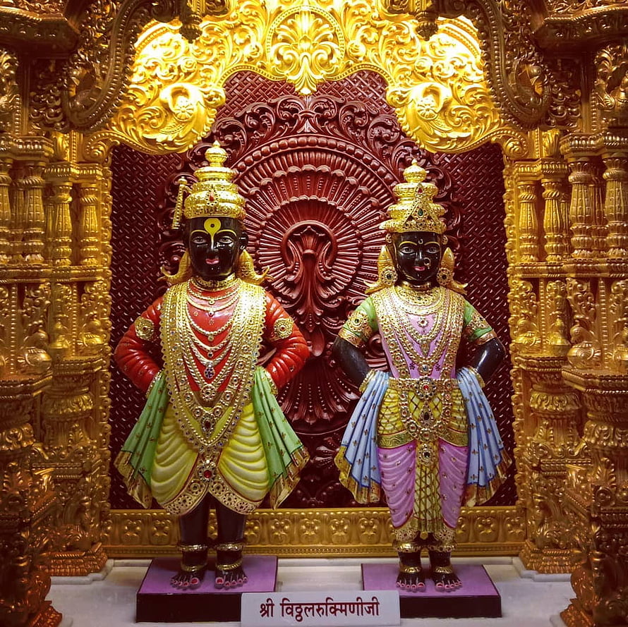 Vitthal and Rukmini Temple Deities in Ornate Gold Carved Shrine HD wallpaper