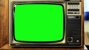 Retro 1980s Television Set Displaying Solid Green Screen on Wooden Surface HD wallpaper