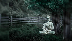 Serene Buddha Statue Meditating in a Misty Forest with Wooden Fence HD wallpaper