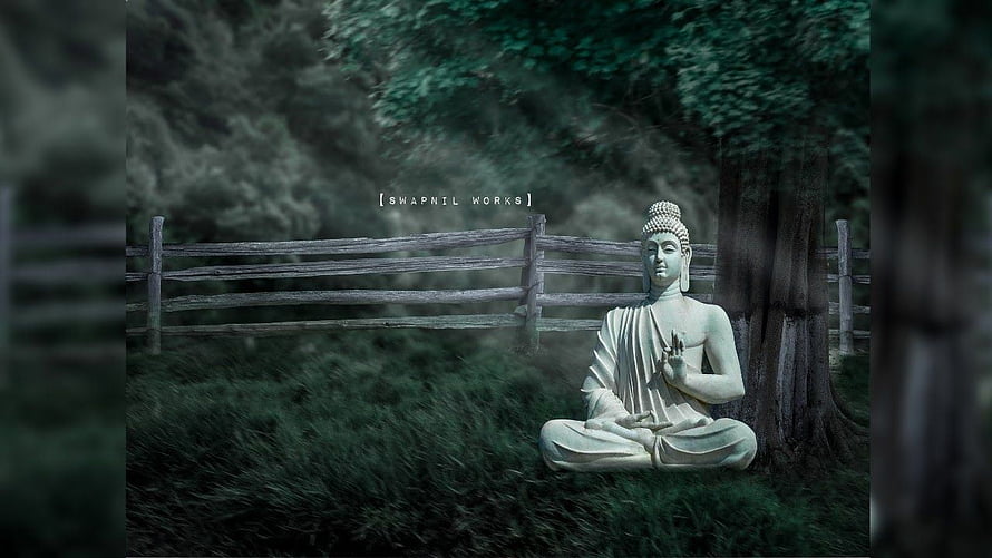 Serene Buddha Statue Meditating in a Misty Forest with Wooden Fence HD wallpaper