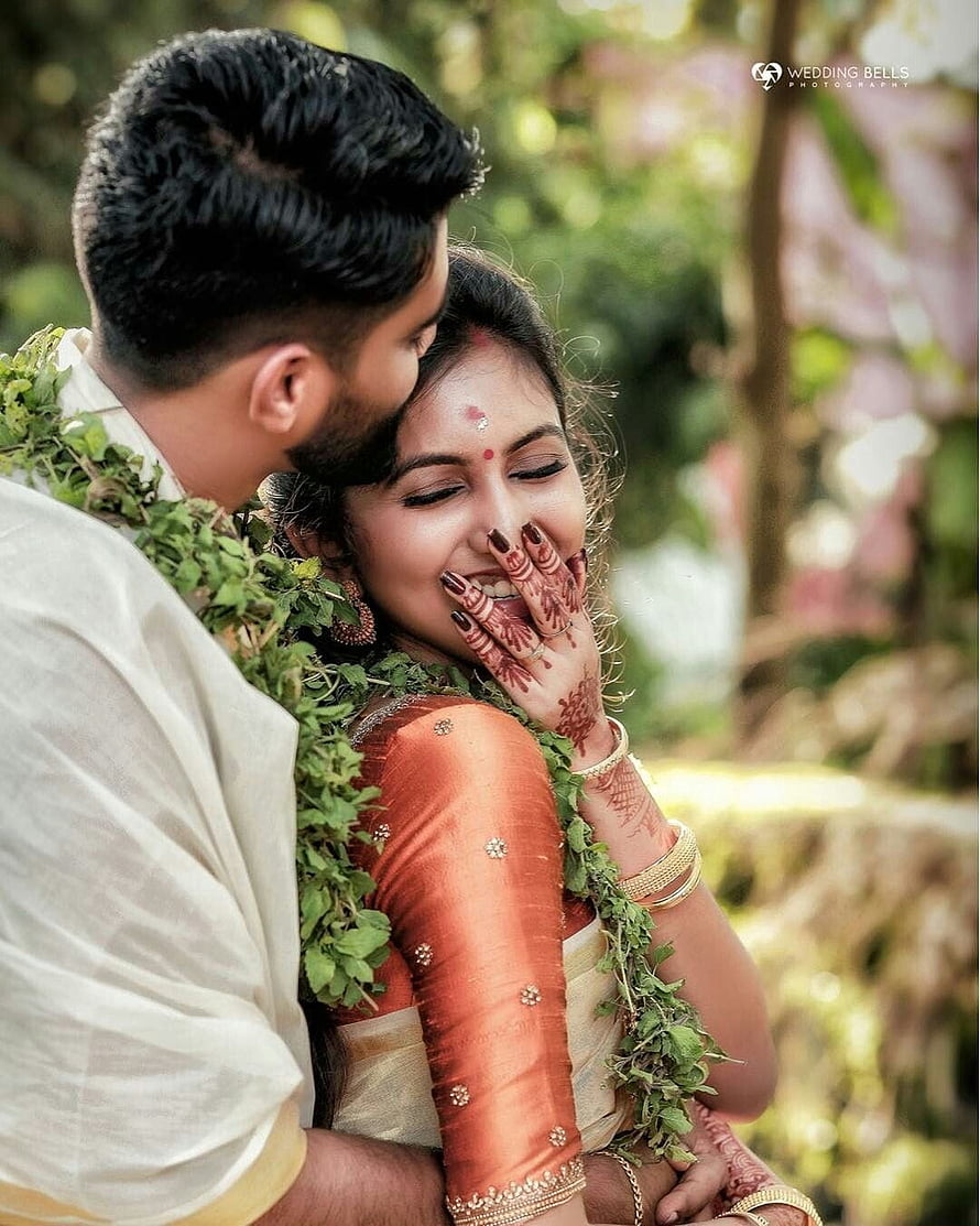 Kerala Wedding Couple in Traditional Attire with Fresh Green Garland and Intricate Henna HD phone wallpaper