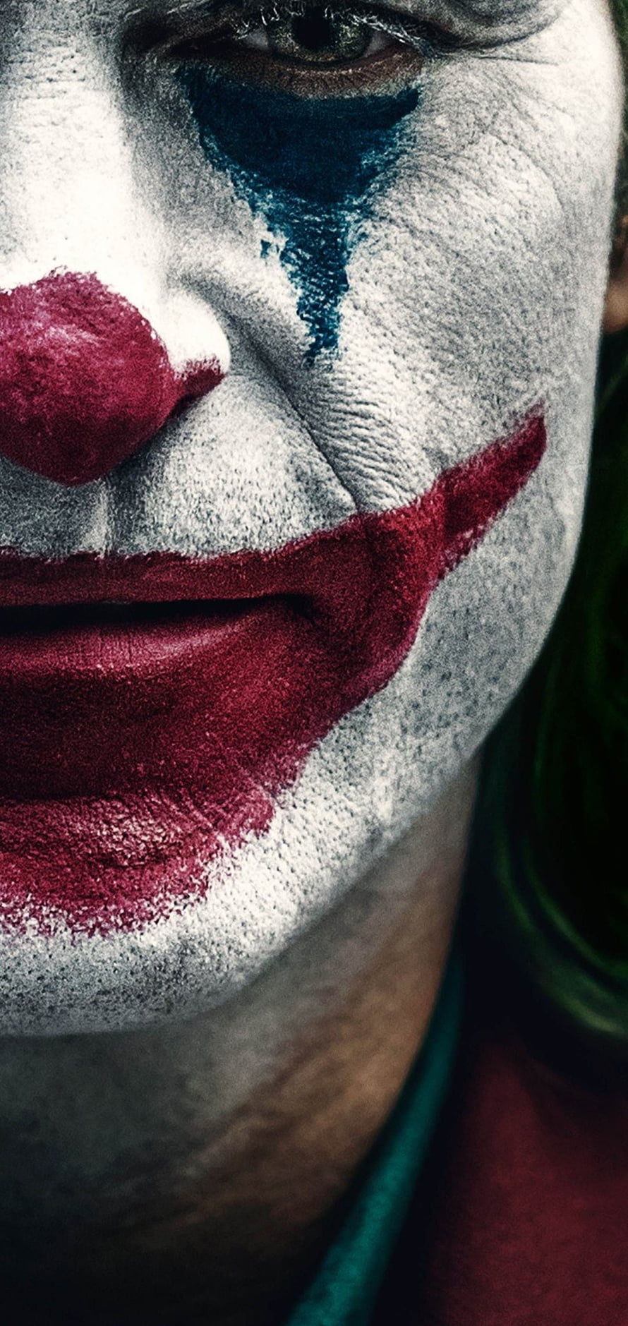 Joker Close-Up Portrait with White Face Paint and Red Smiling Makeup HD phone wallpaper