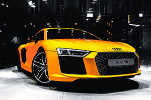 Vibrant Orange Audi R8 Supercar Showcased at Auto Exhibition HD wallpaper