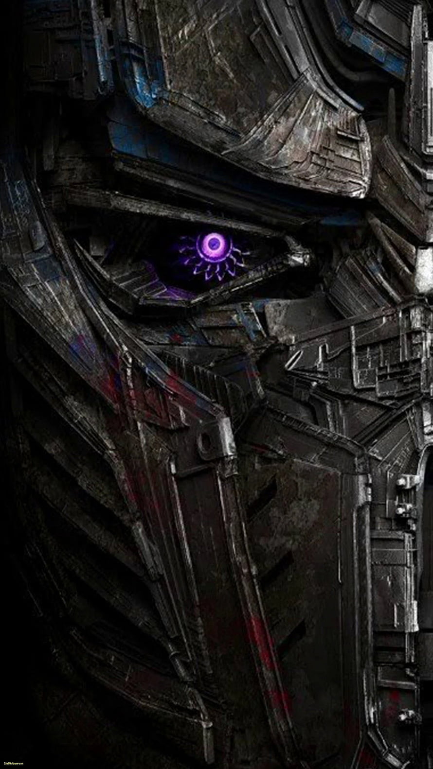 Optimus Prime Close-Up Face With Glowing Purple Eye In Dark Industrial Setting HD phone wallpaper
