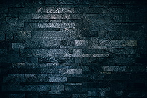 Dark Slate Stone Brick Wall Texture with Ribbed Tile Pattern and Moody Industrial Aesthetic HD wallpaper