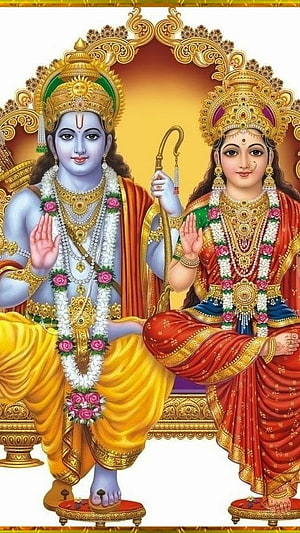 Lord Rama and Sita in Traditional Indian Temple Art with Golden Ornaments and Floral Garlands HD phone wallpaper