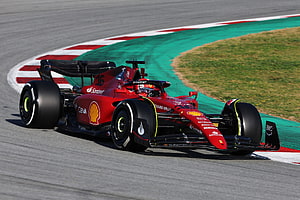 Charles Leclerc Ferrari F1 Car Cornering on Circuit Track HD wallpaper