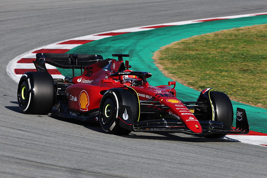 Charles Leclerc Ferrari F1 Car Cornering on Circuit Track HD wallpaper