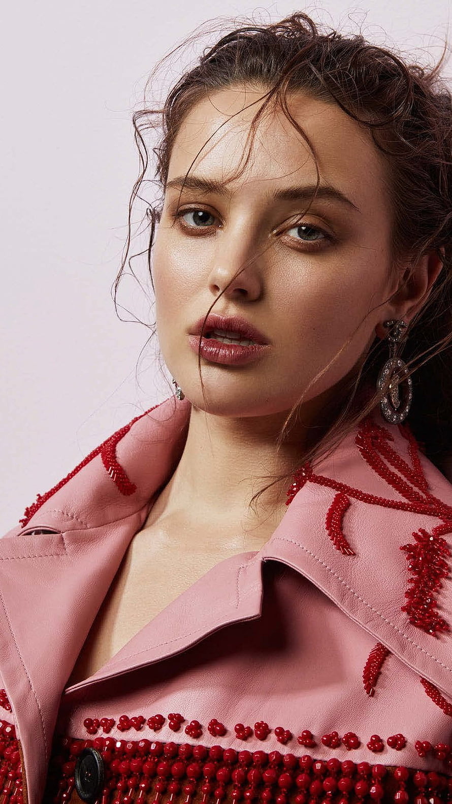 Katherine Langford in a pink beaded jacket with wet hair and statement earrings HD phone wallpaper