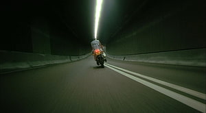 Motorcyclist Riding Through a Dark Tunnel in Fallen Angels by Wong Kar-wai HD wallpaper