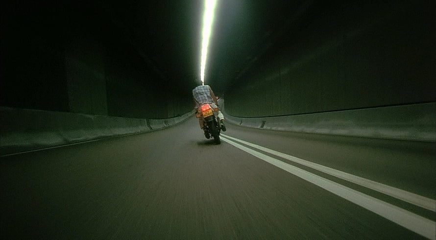 Motorcyclist Riding Through a Dark Tunnel in Fallen Angels by Wong Kar-wai HD wallpaper
