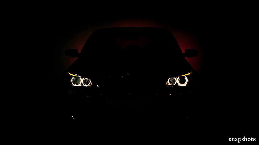 BMW M5 E60 Front Headlights Glowing in Darkness with Dramatic Red Backlight HD wallpaper