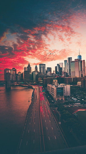 New York City Skyline at Sunset with FDR Drive and Manhattan Skyline HD phone wallpaper