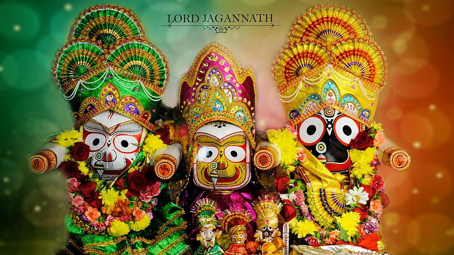 Lord Jagannath with Subhadra and Balabhadra adorned in vibrant floral garlands and ornate crowns HD wallpaper