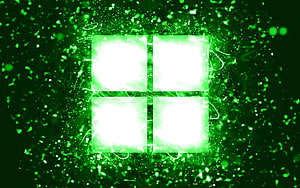 Glowing Green Microsoft Windows Logo with Neon Particle Effects and Abstract Digital Background HD wallpaper