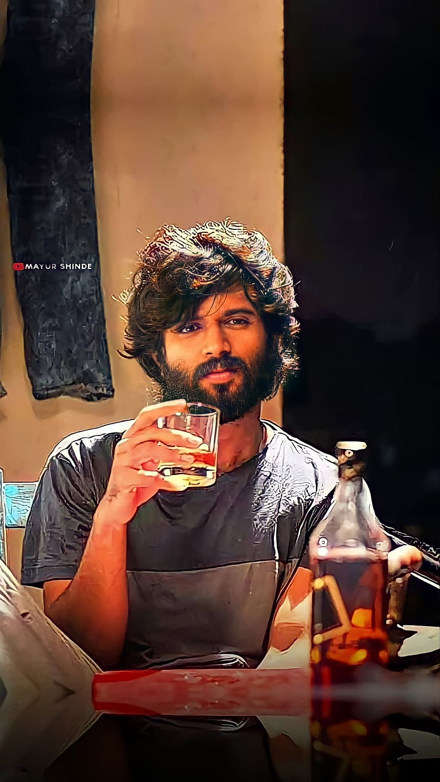 Vijay Deverakonda as Arjun Reddy Holding a Glass of Whiskey in a Dimly Lit Scene HD phone wallpaper