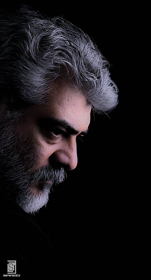 Thala Ajith Dramatic Profile Portrait with Grey Hair and Beard Against Black Background HD phone wallpaper