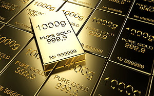Stacked Pure Gold Bars with 999.9 Purity Markings and Weight Labels HD wallpaper