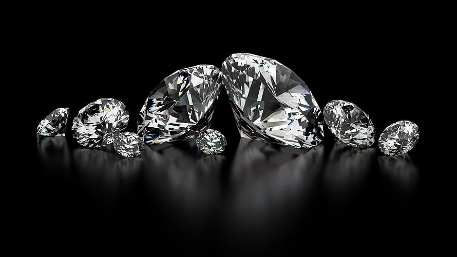 Faceted Diamond Collection on Black Reflective Surface HD wallpaper
