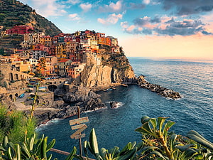 Cinque Terre Coastal Village Perched on Dramatic Mediterranean Cliffs at Golden Hour HD wallpaper