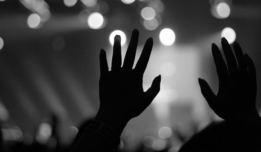 Silhouette of Raised Hands in Black and White Worship Setting HD wallpaper