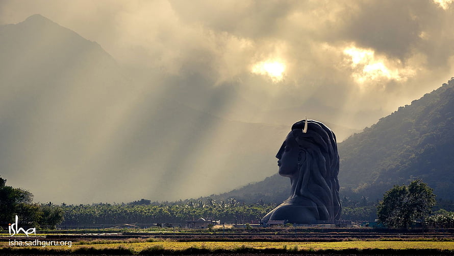 Adiyogi Statue at Isha Yoga Center with Misty Mountains and Golden Sunlight HD wallpaper