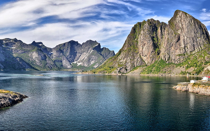 Serene Fjord Landscape with Steep Rocky Mountains and Calm Water Under a Blue Sky HD wallpaper