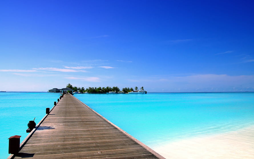 Tropical Island View With Wooden Pier Extending Into Turquoise Ocean Water HD wallpaper